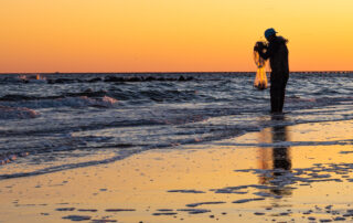 Cast Net Fisherman enjoying the early sun on East Ocean View Beach
