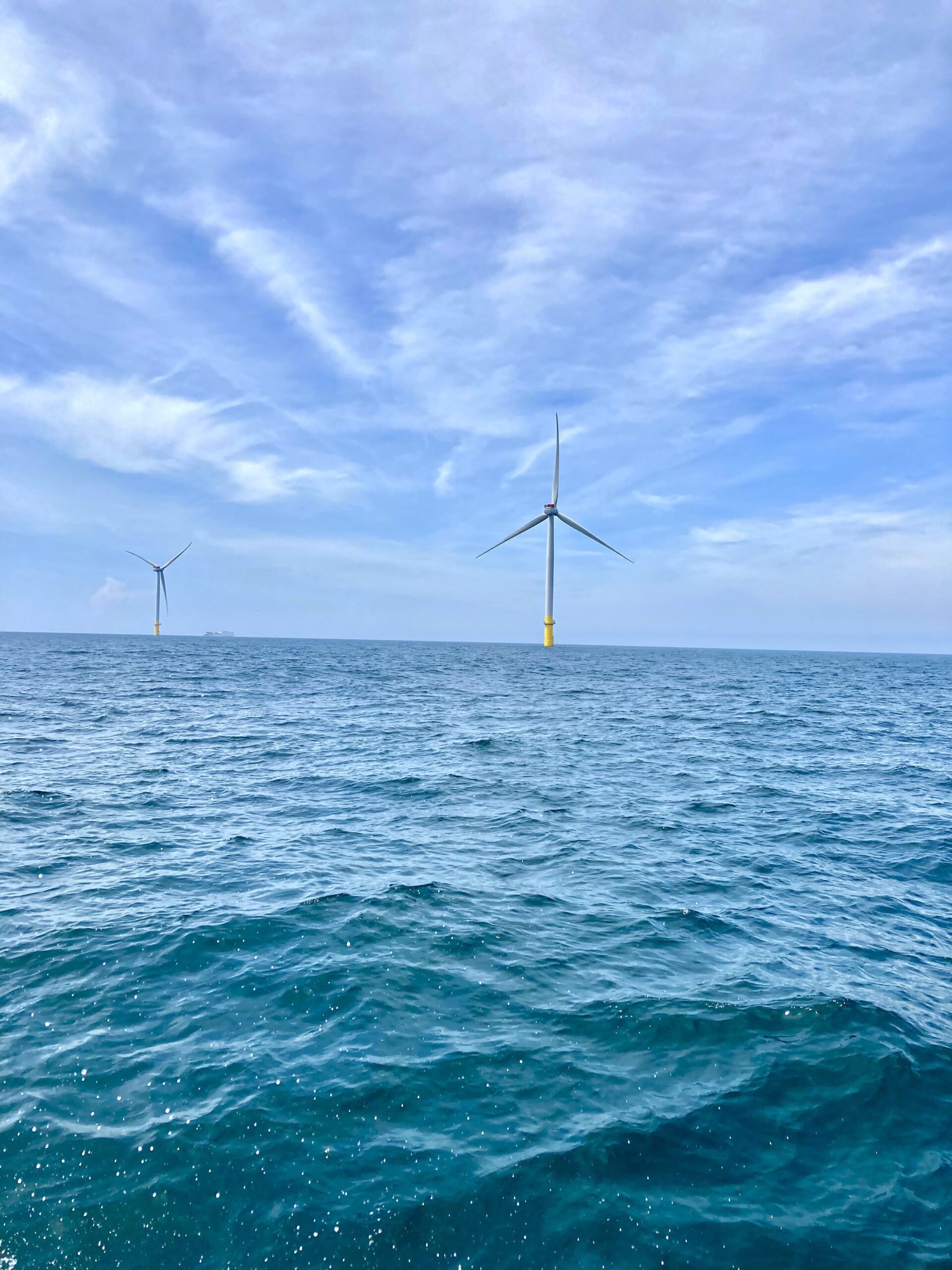Coastal Virginia Offshore Wind test turbines off the coast of Virginia Beach, Virginia. Photo by Hunter Noffsinger
