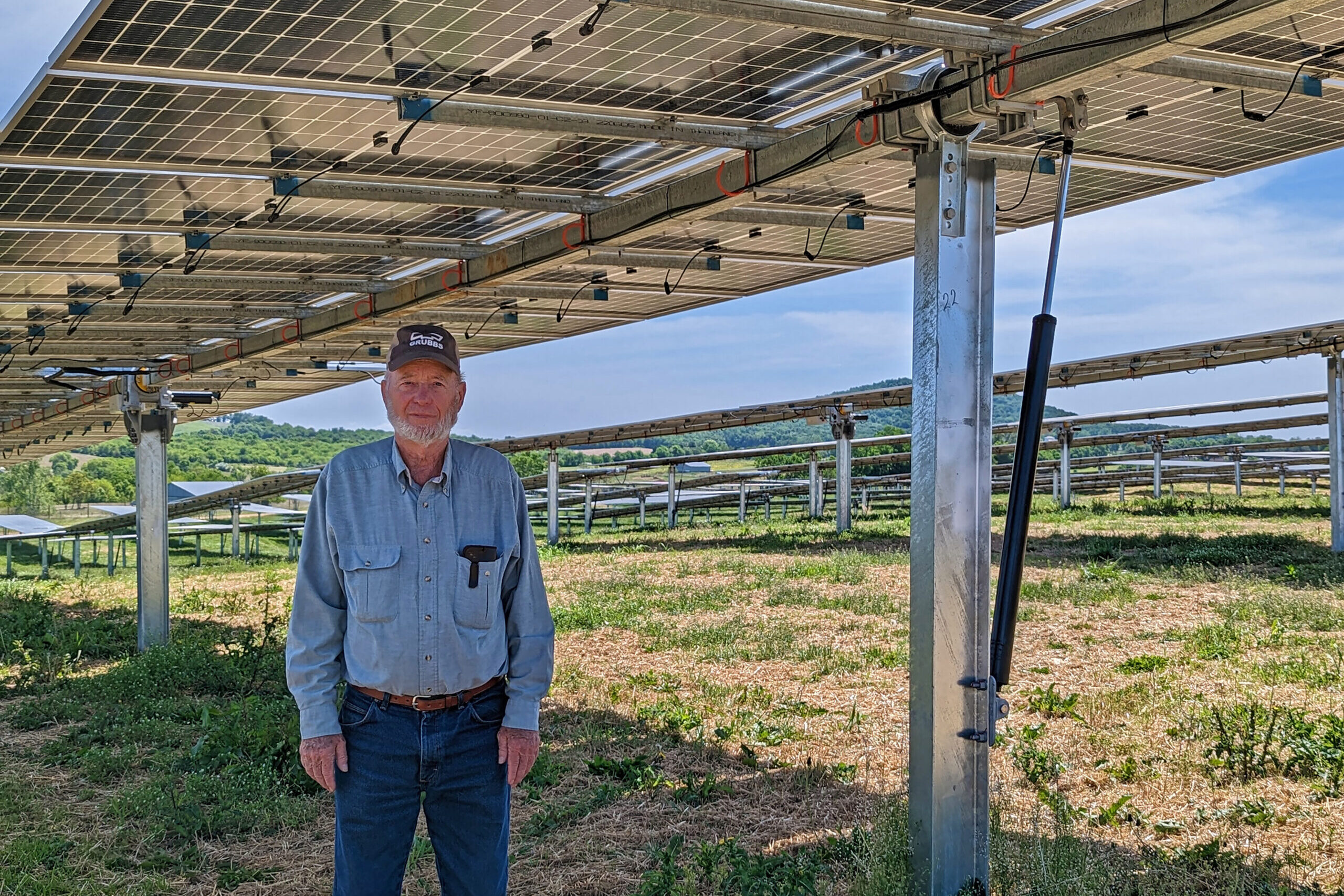 Man under Shenandoah Valley Electric Coop solar array